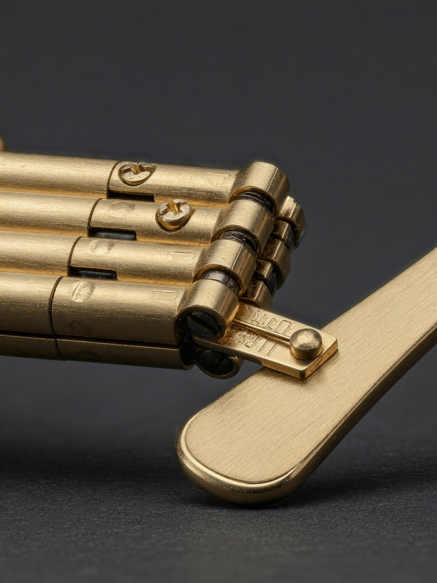 Five-barrel gold hinge and temple detail